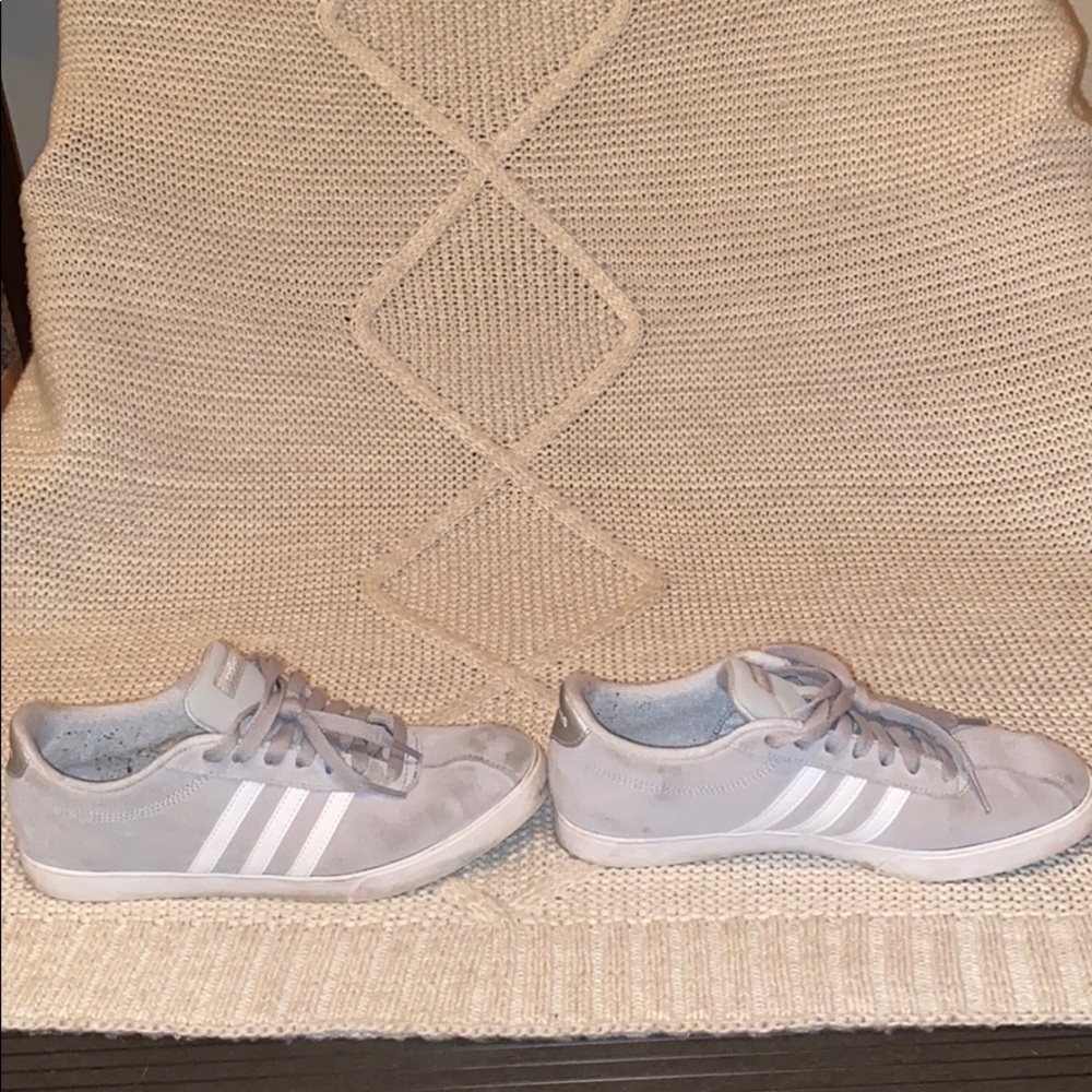 Gray and white Adidas shoes